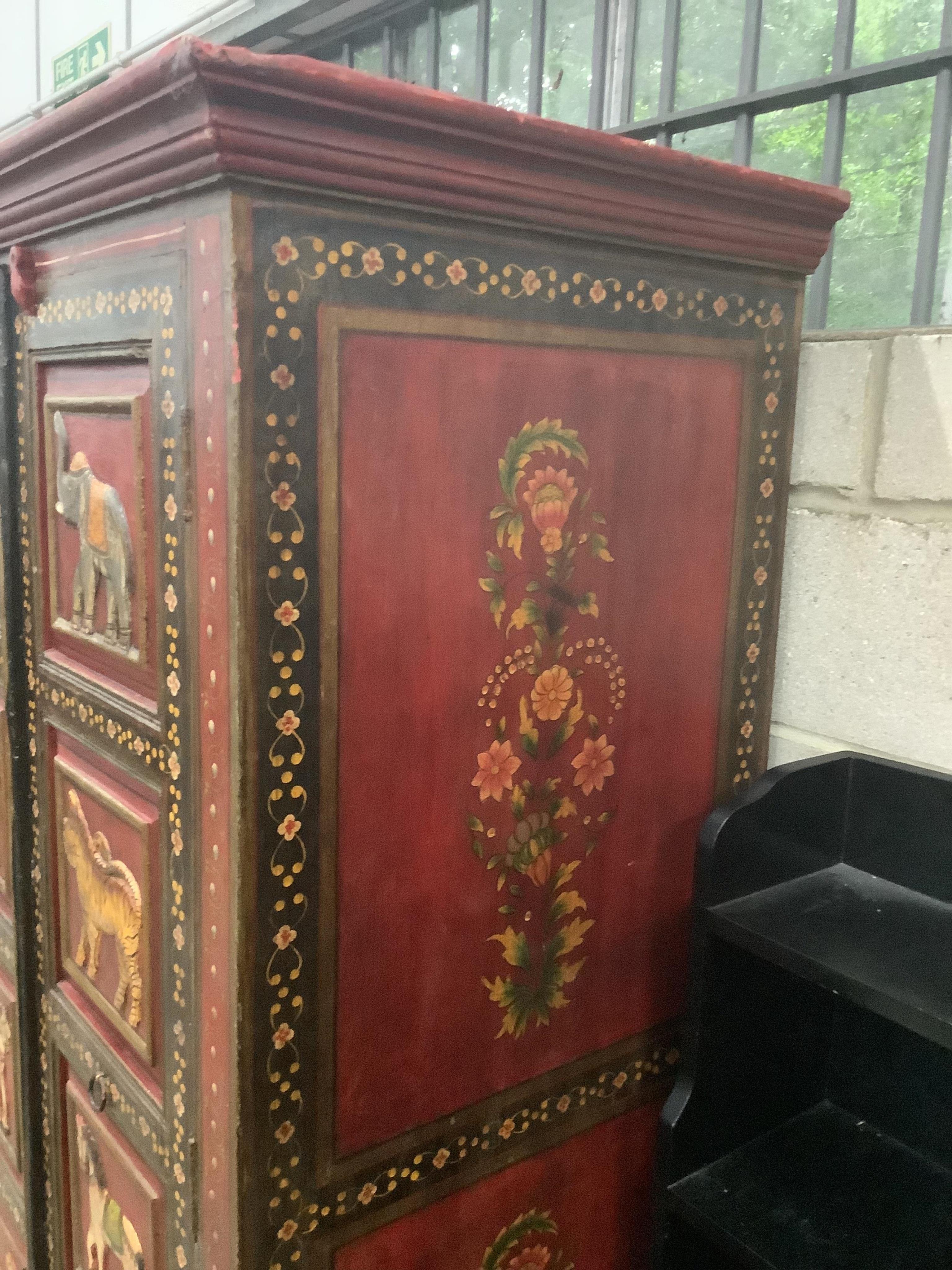 An Indian painted two door hall cupboard, width 100cm, depth 60cm, height 164cm. Condition - fair